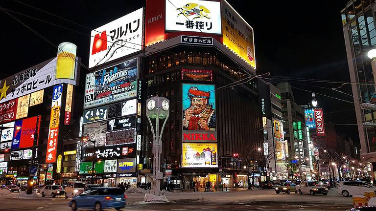Downtown Susukino at night, the nightlife district of Sapporo, Japan. The neighborhood comes alive with bright screens and a vibrant culture.