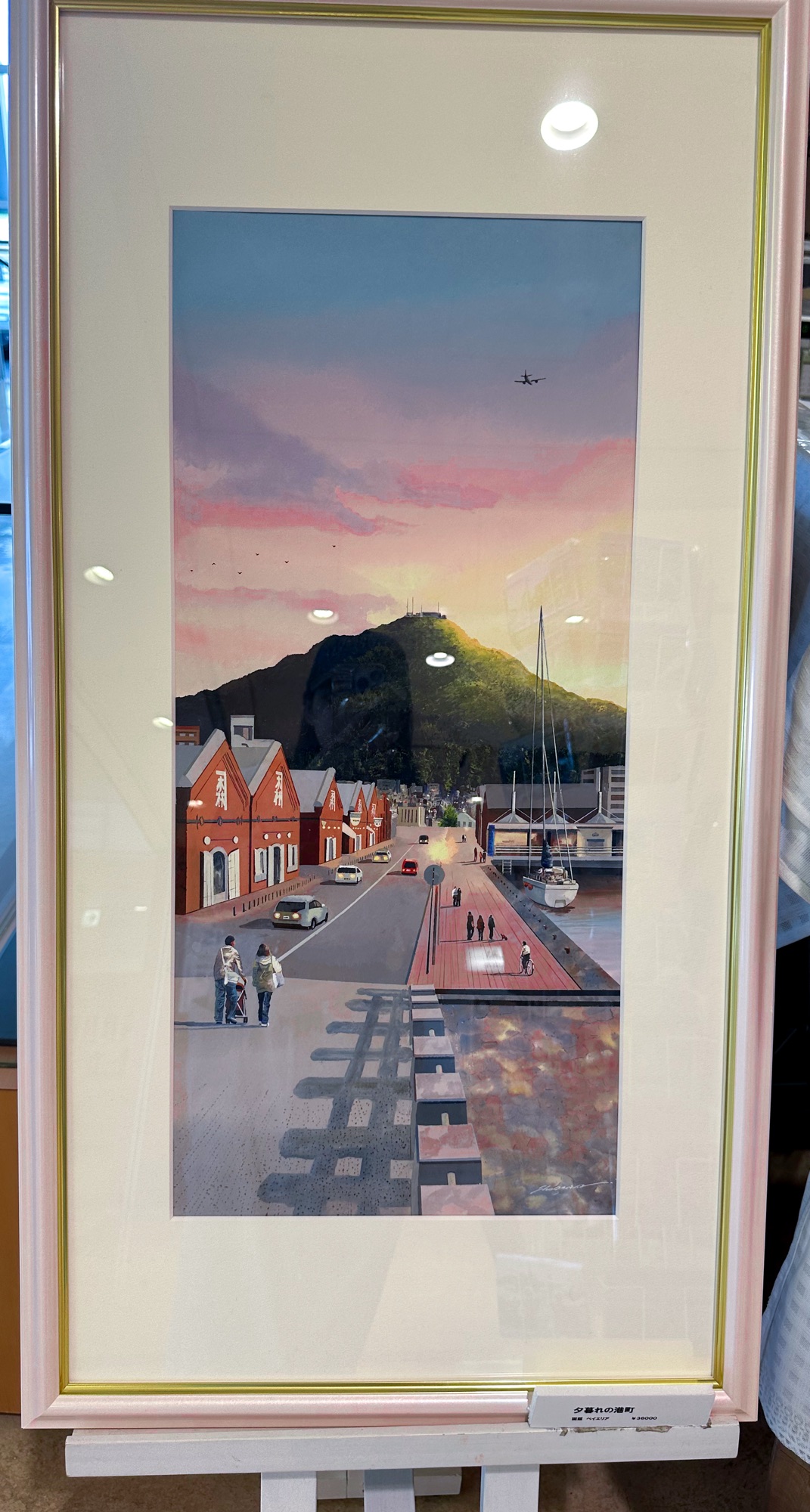 A painting of the Kanemori Red Brick Warehouse during sunset in Hakodate, Hokkaido. The painting was created by local artist Sho Onishi.