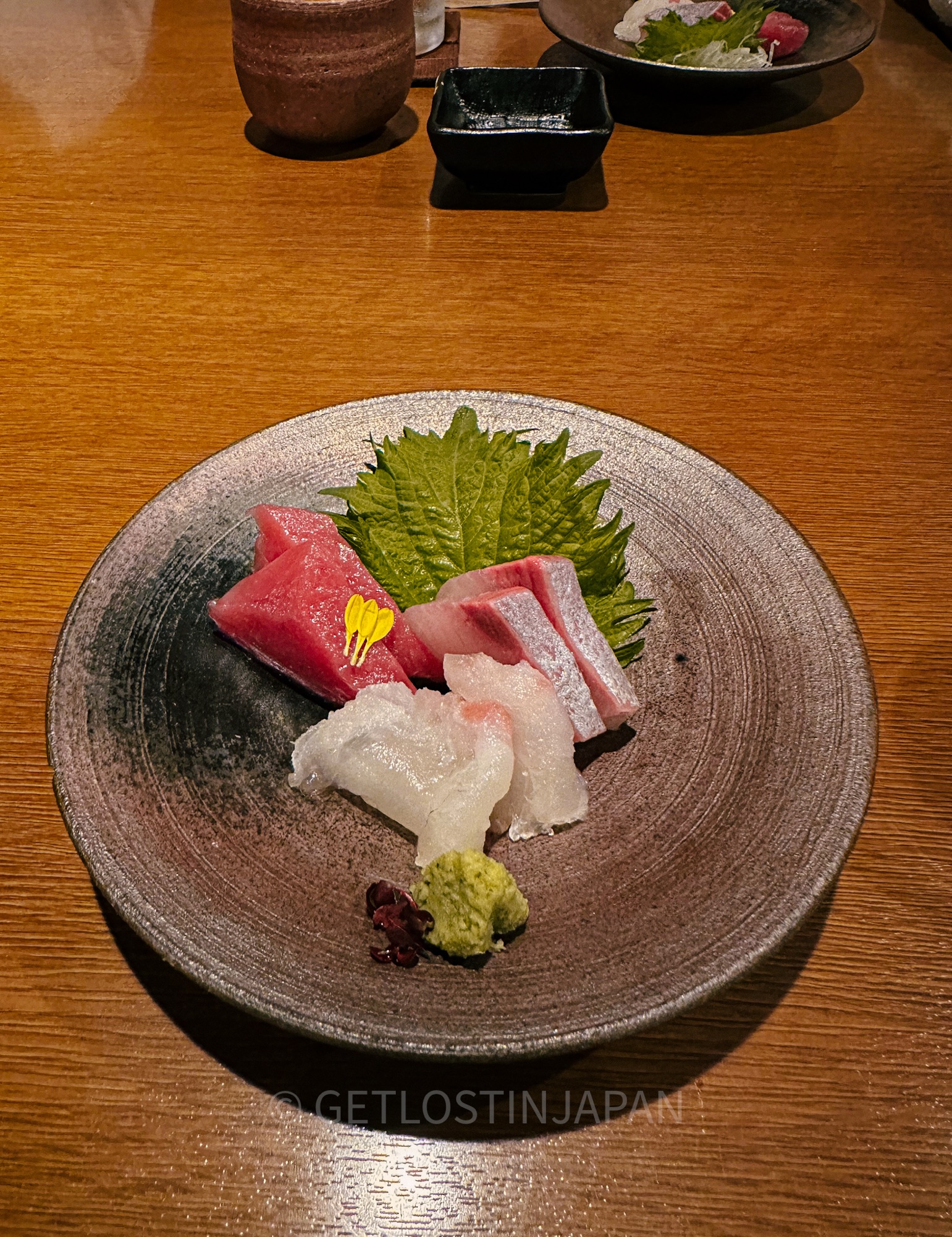 An array of fish are prepared as sashimi as part of a kaiseki course meal in Kyoto, Japan.