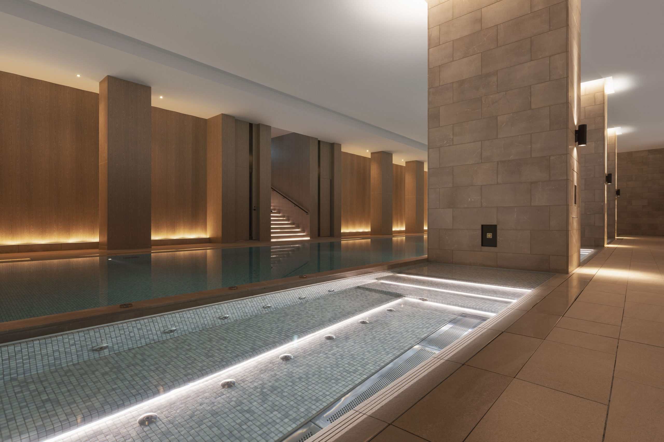 Luxury wellness pool at Park Hyatt Niseko Hanazono, offering serene design and warm lighting, perfect for those seeking relaxation in 5 star hotels near Sapporo.
