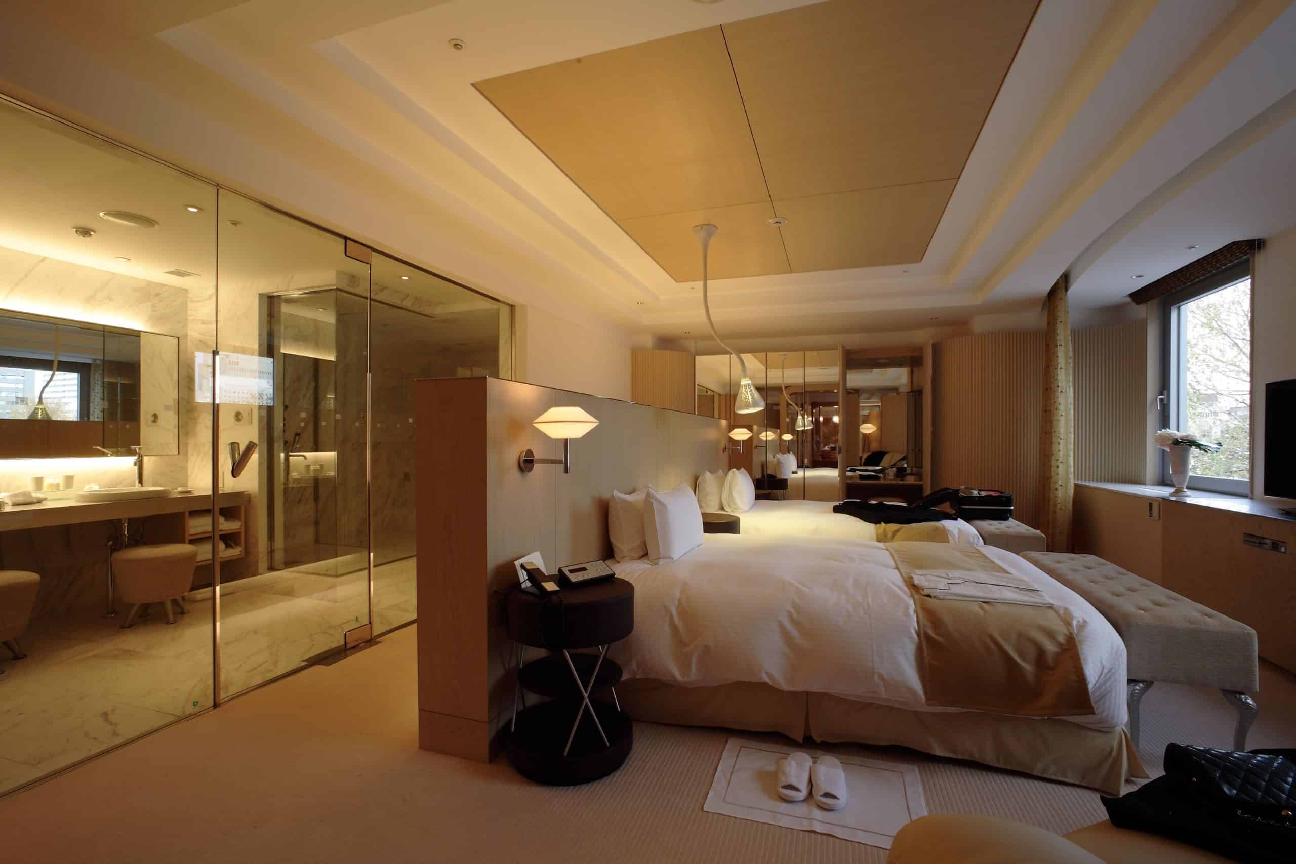 Spacious suite at Sapporo Grand Hotel with elegant design and a marble-finished glass bathroom for a premium stay.