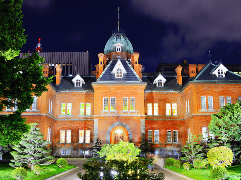 The historic Red Brick Office glowing under night lights—great for sightseeing and photography among things to do in Sapporo at night.