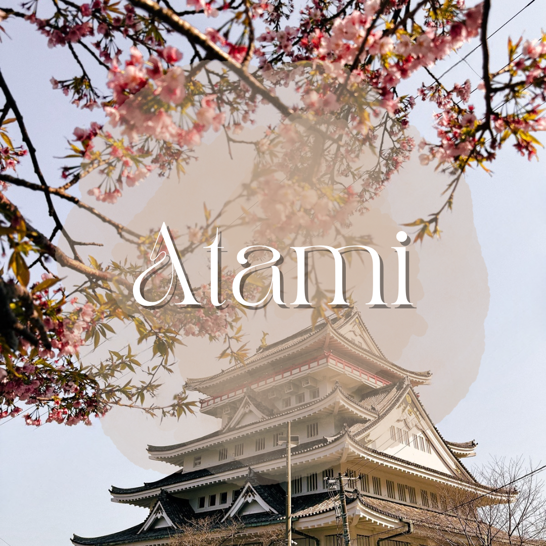 A logo of Atami. Atami Castle is pictured in the back with blossoming cherry blossoms, and it says Atami in white letters on the front.