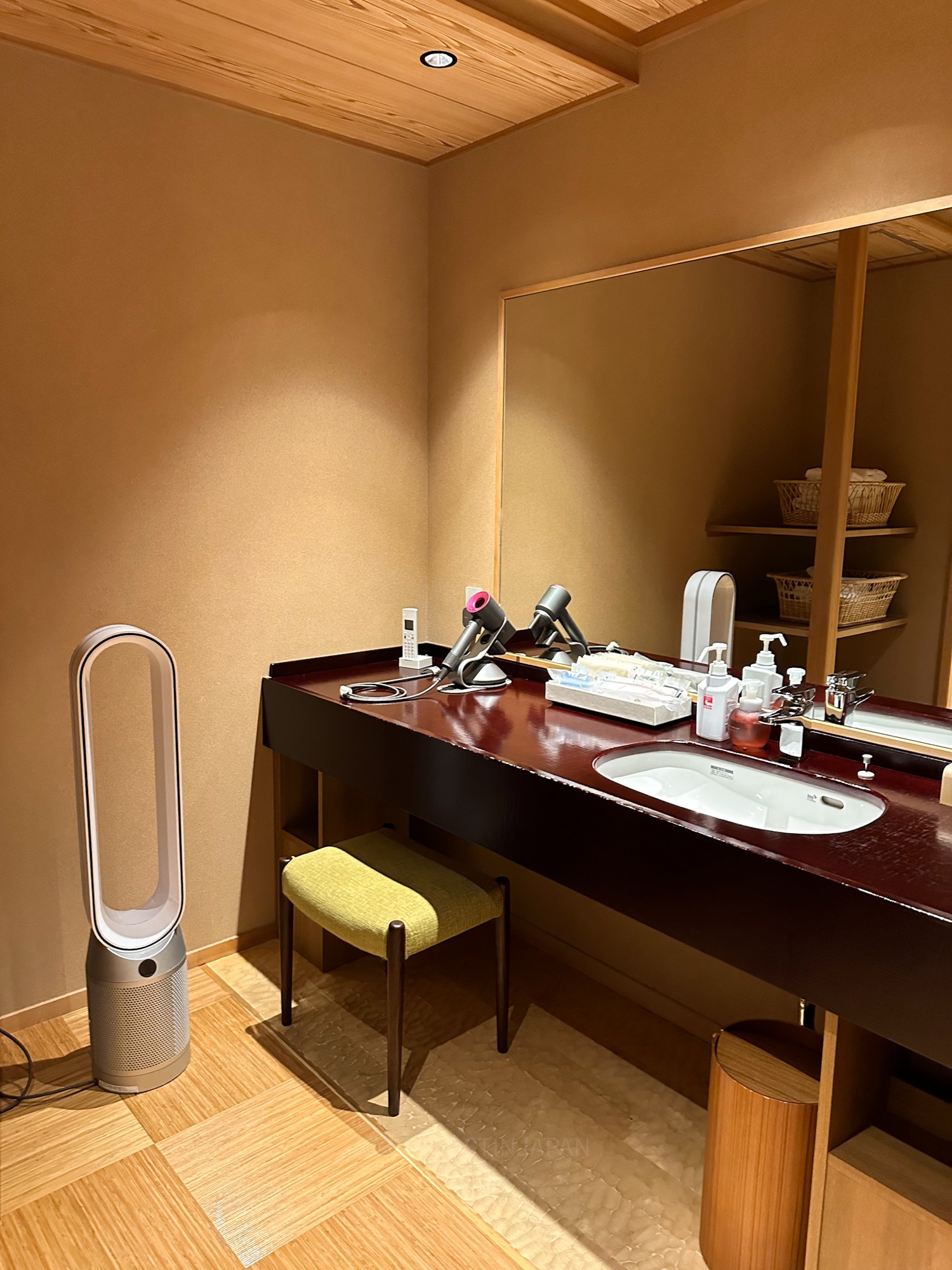 Elegant vanity area with Dyson hair dryer and beauty amenities at Saka Hotel Kyoto