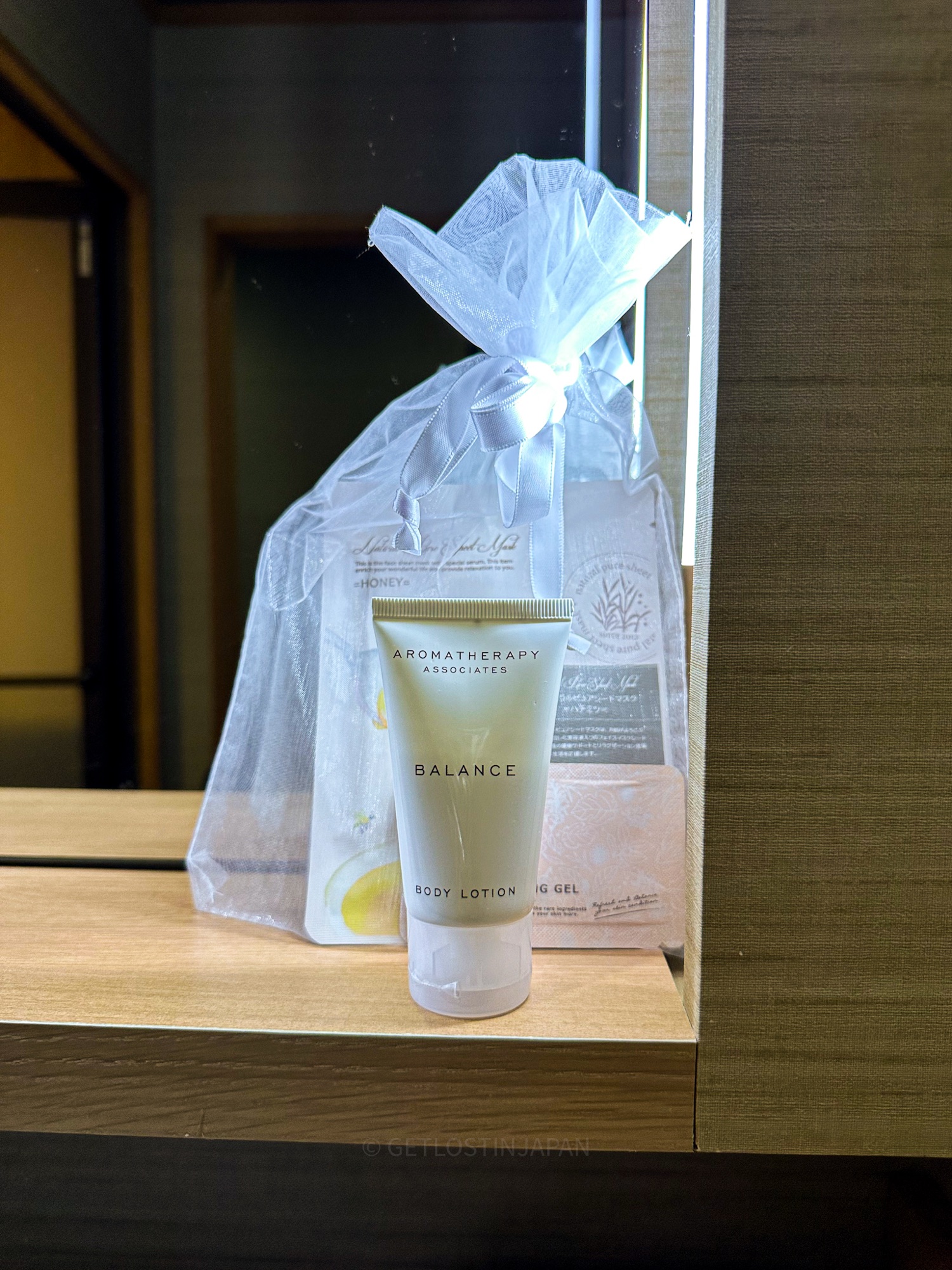 Welcome gift at Saka Hotel Kyoto featuring Aromatherapy Associates body lotion in a sheer white gift bag