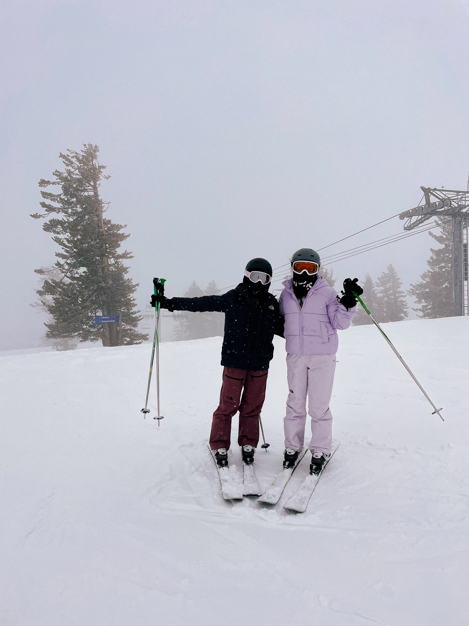 Friends skiing in Niseko’s powder snow, a must-try activity when searching for winter things to do in Niseko.
