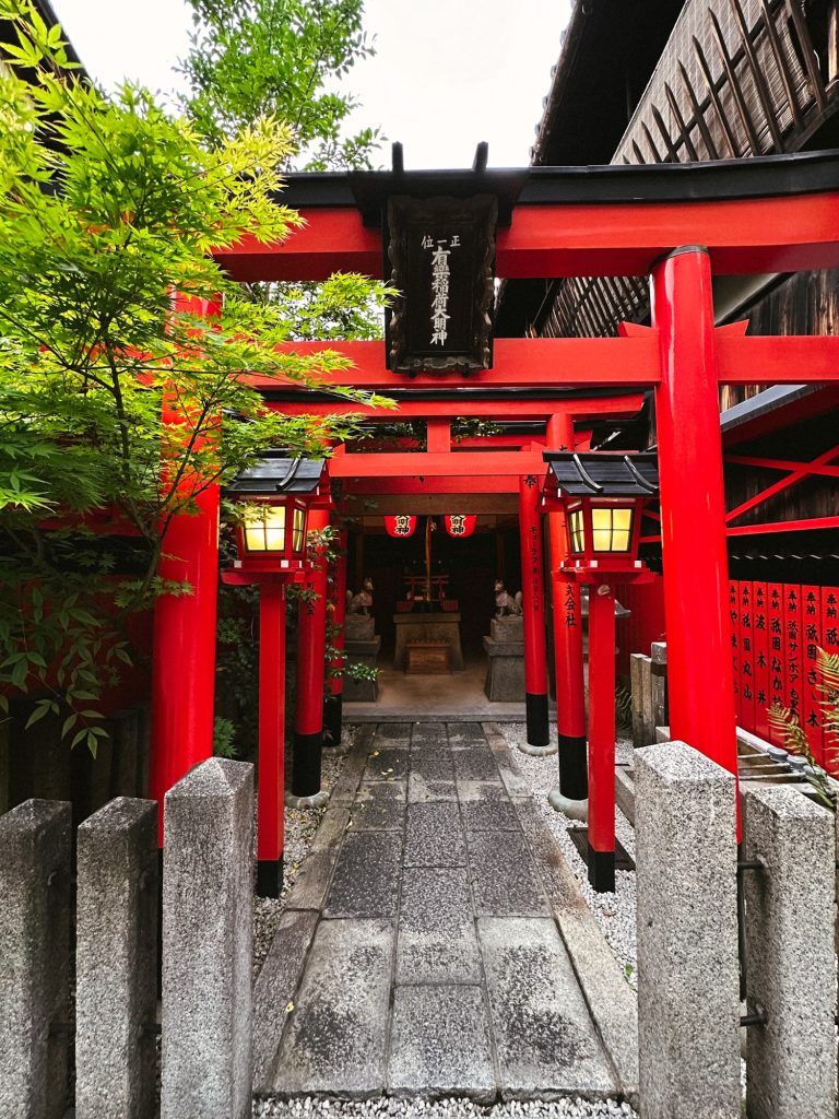 Small Shinto shrine with striking red torii gates hidden in Gion, a charming find during your one day in Kyoto.