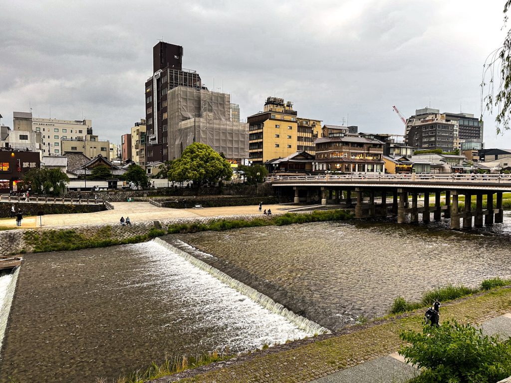 Scenic view of Shijo Bridge over the Kamo River in Gion, a beautiful stop to include in your one day Kyoto itinerary.