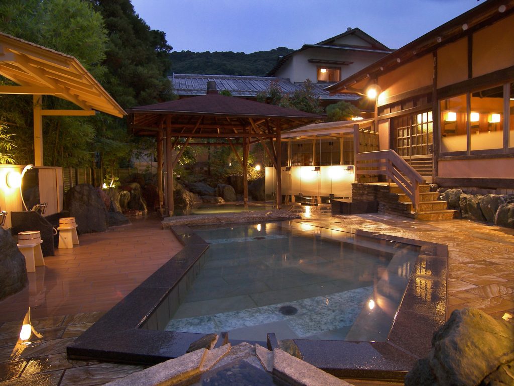 Outdoor hot spring bath at Atami Sekitei, an Atami hotel with private onsen set in a peaceful garden.