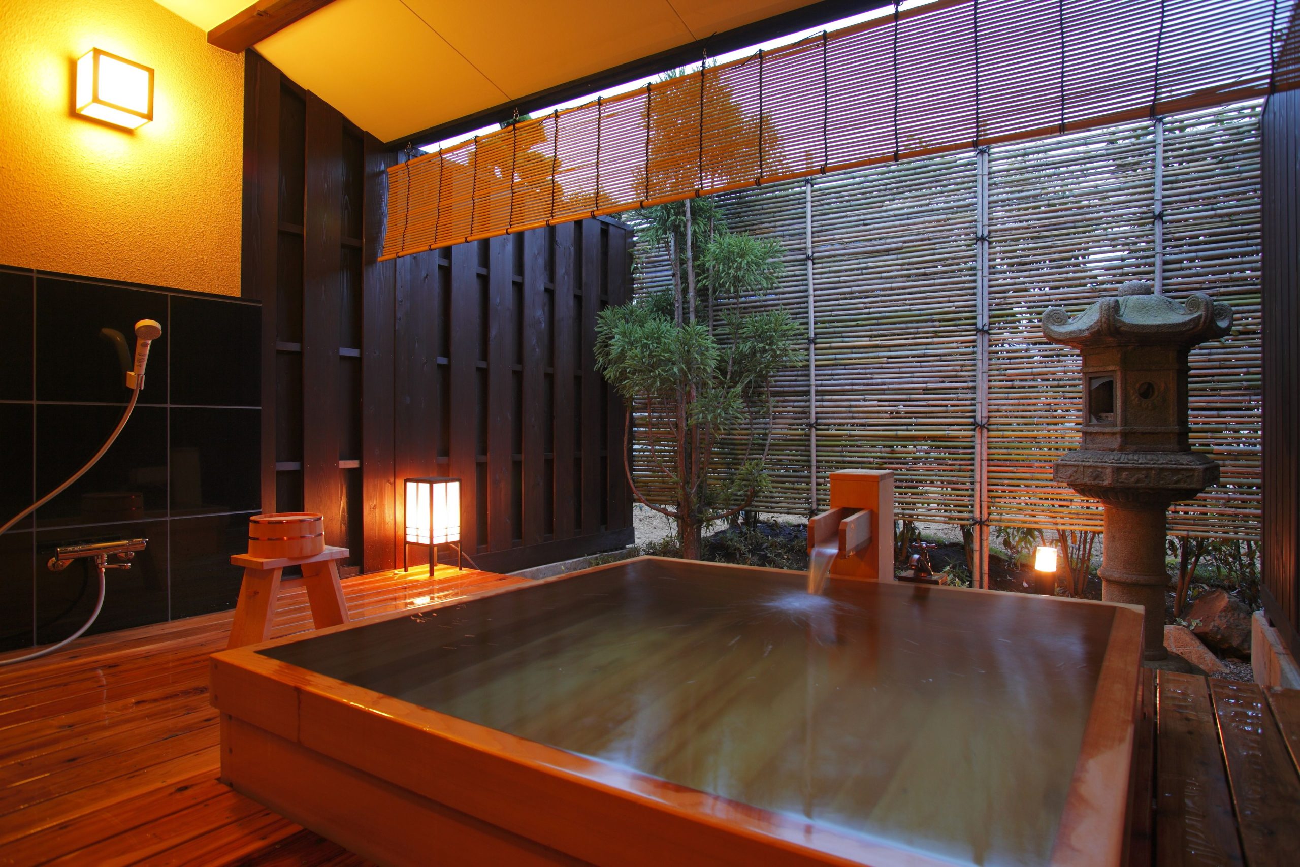 Traditional wooden bath at Yuyado Ichibanchi, an Atami hotel with private onsen for a relaxing stay.