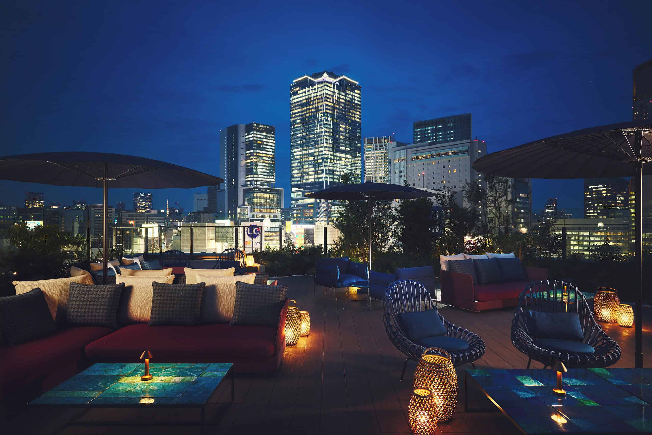 Stylish rooftop lounge at Hotel Indigo Tokyo Shibuya offering modern design and night views.