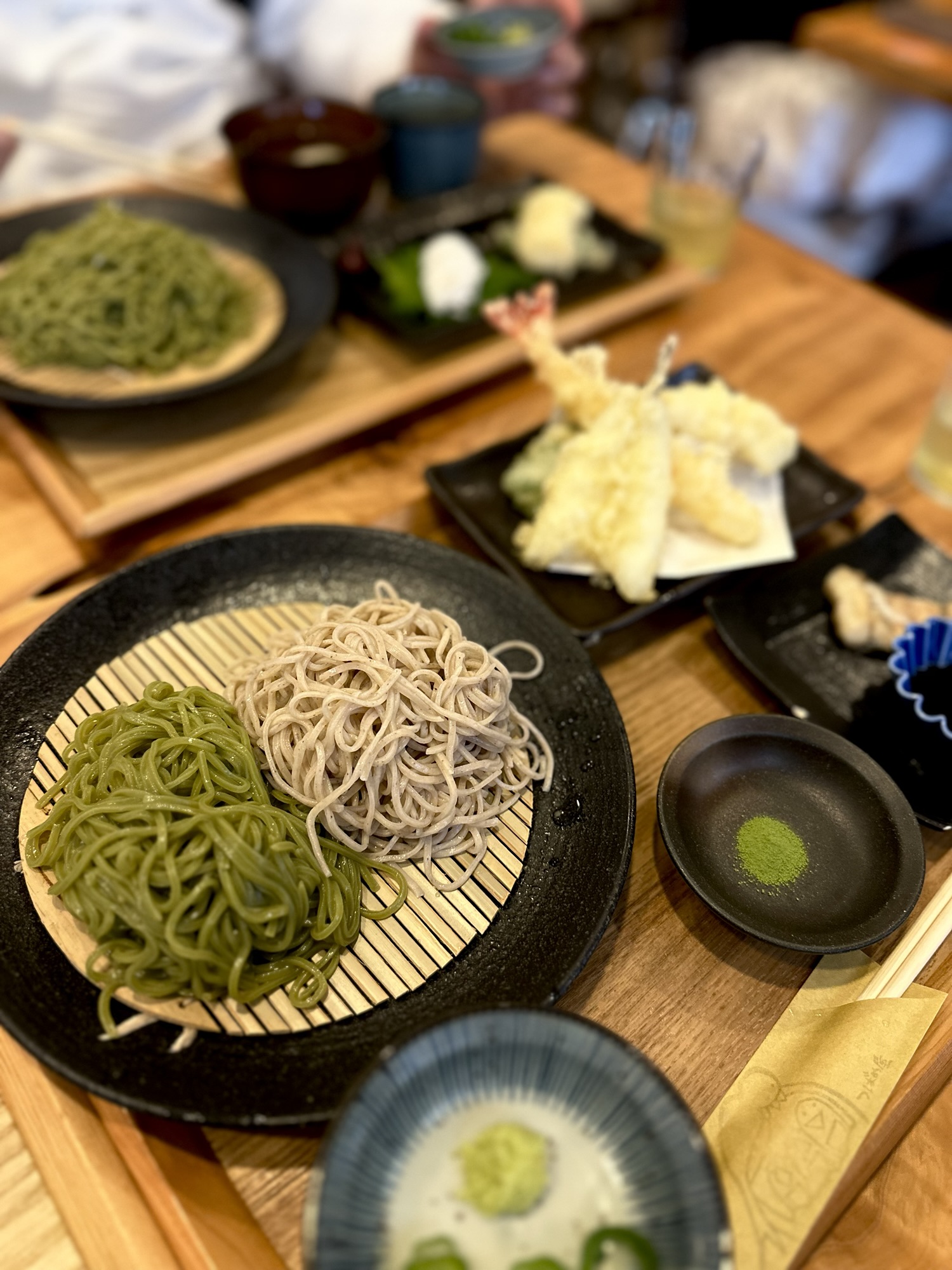 Matcha and buckwheat soba noodles with shrimp tempura served for lunch in Uji