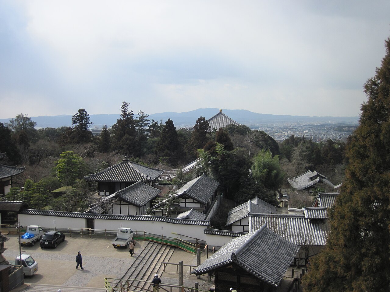 View from Nigatsu do Hall overlooking Nara temple rooftops and mountains