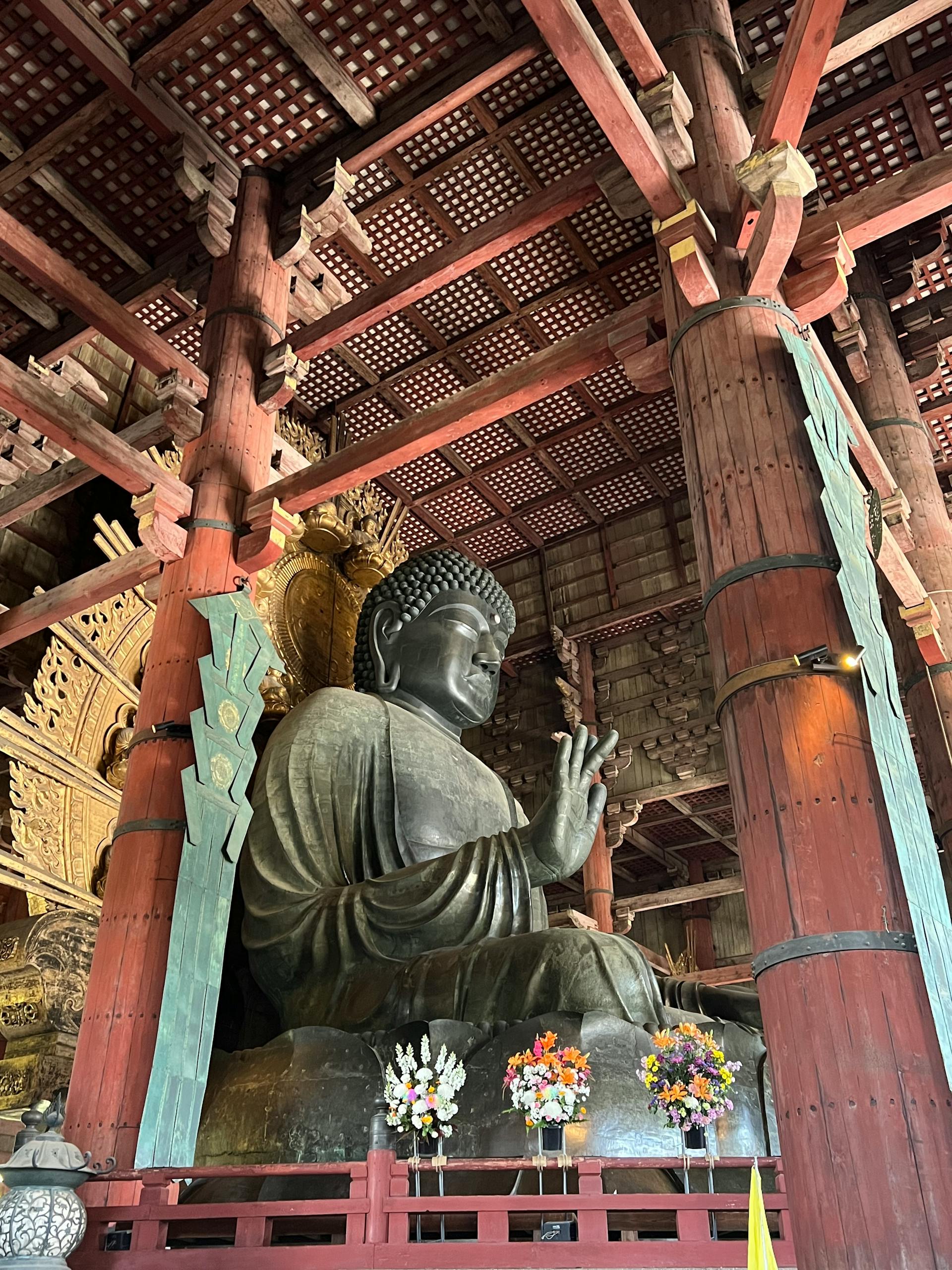 Majestic bronze Buddha statue inside the historic Todaiji Temple in Nara, Japan.